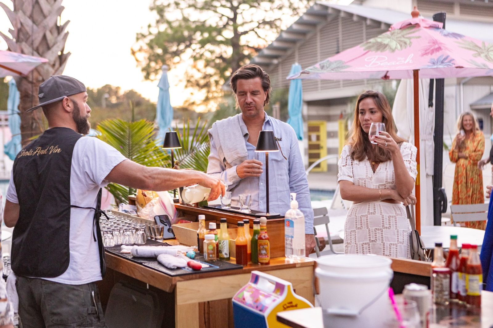 Cocktail bar service on the pool deck at sunset